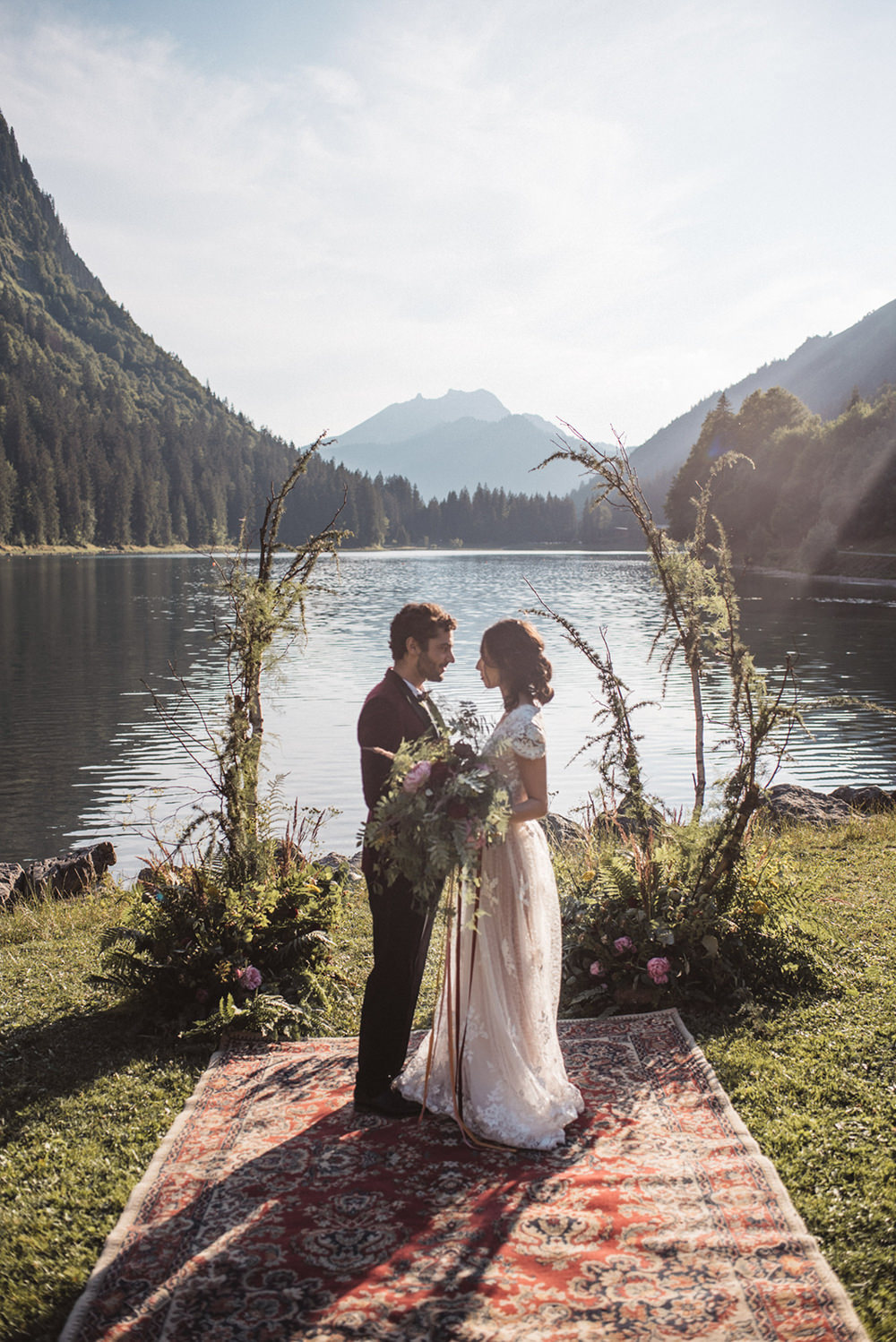 Backdrop Flowers Ceremony Persian Rug Aisle Branches Lake Outdoor French Alps Folk Boho Mountain Wedding Ideas Katja & Simon Photography