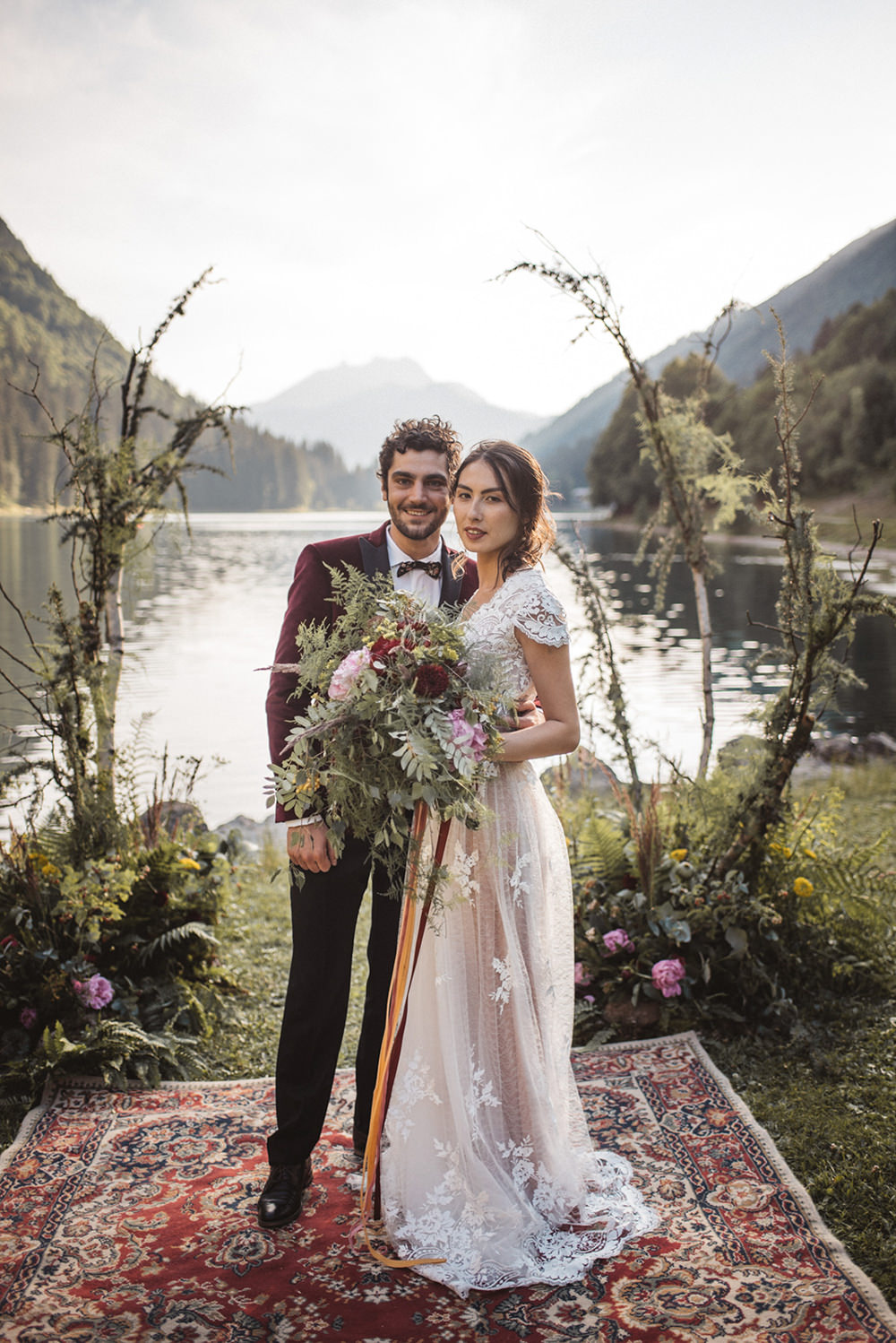 Backdrop Flowers Ceremony Persian Rug Aisle Branches Lake Outdoor French Alps Folk Boho Mountain Wedding Ideas Katja & Simon Photography
