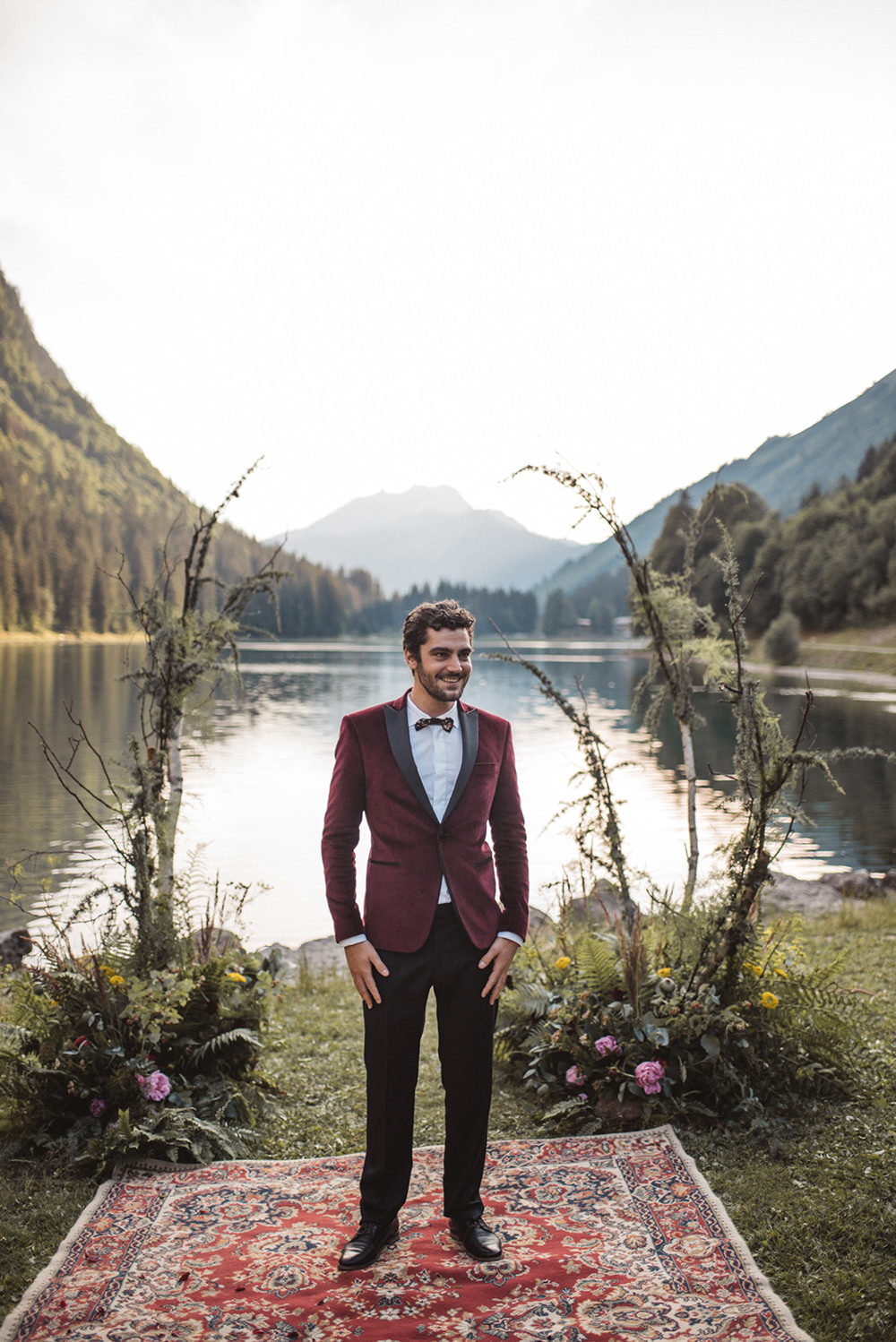 Groom Suit Red Burgundy Velvet Jacket Bow Tie French Alps Folk Boho Mountain Wedding Ideas Katja & Simon Photography