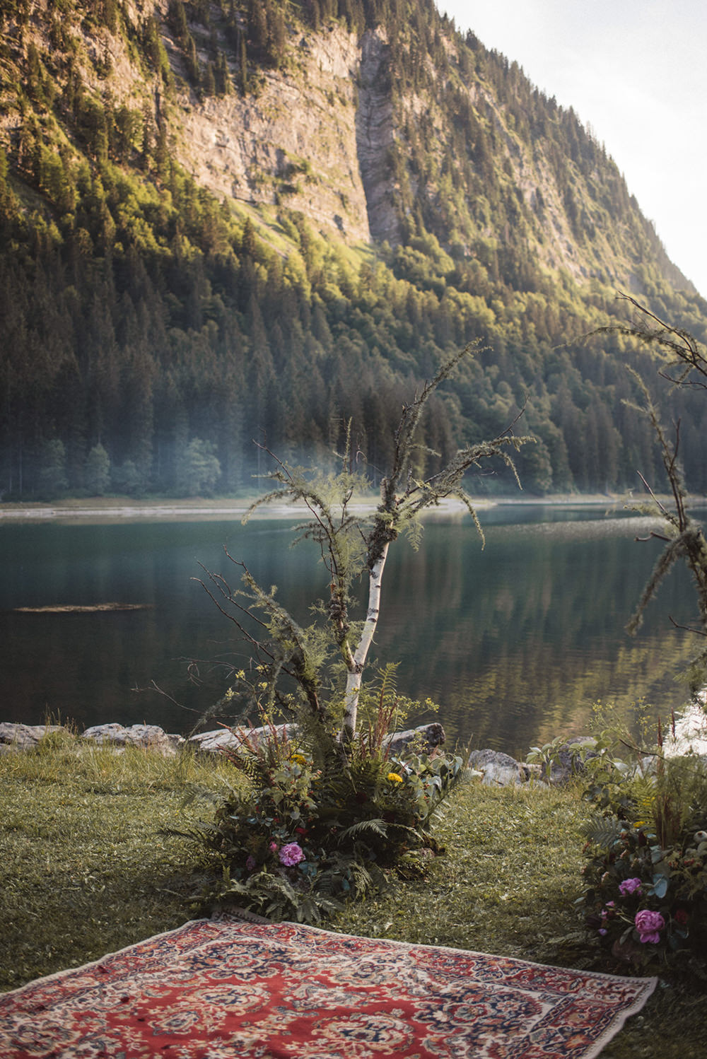 Backdrop Flowers Ceremony Persian Rug Aisle Branches Lake Outdoor French Alps Folk Boho Mountain Wedding Ideas Katja & Simon Photography
