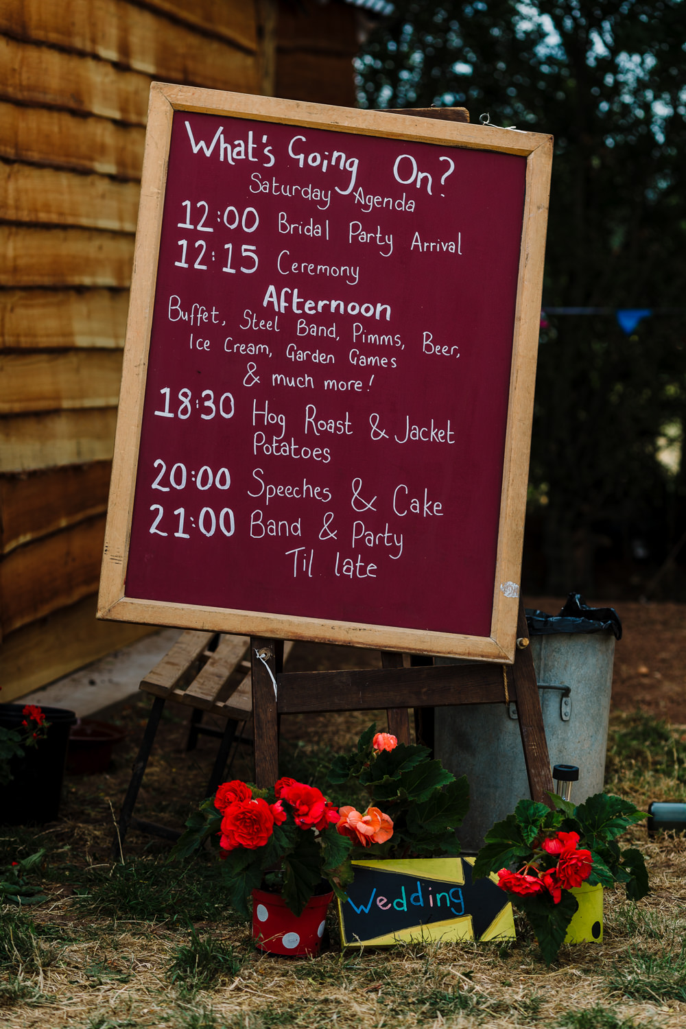 Red Timings Order Day Sign Fun Colourful Festival Camp Wedding Rachel Burt Photography