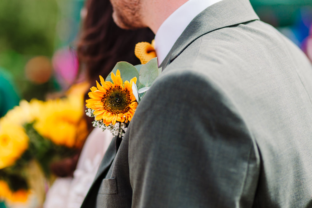 Sunflower Buttonhole Groom Fun Colourful Festival Camp Wedding Rachel Burt Photography