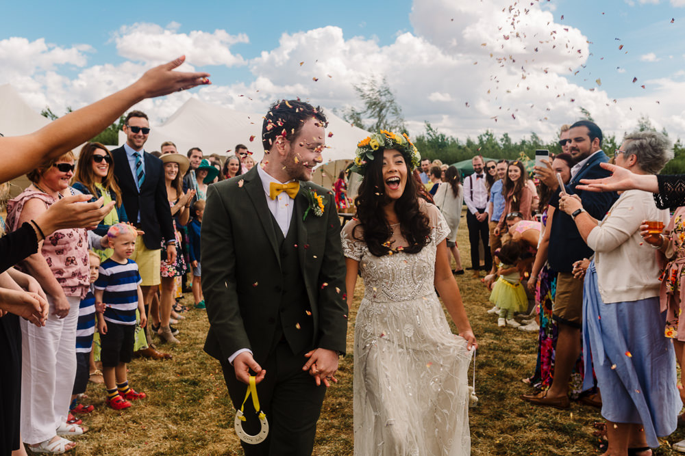 Confetti Throw Bride Groom Fun Colourful Festival Camp Wedding Rachel Burt Photography