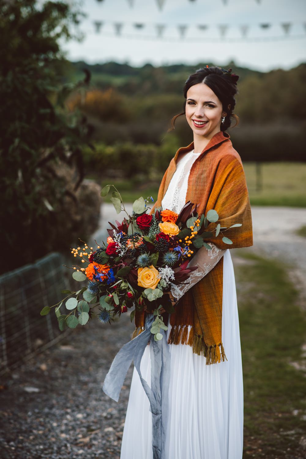 Bouquet Flowers Bride Bridal Blue Delphiniums Thistles Grey Eucalyptus Orange Roses Dahlias Red Amaranthus Ribbons Rustic Christmas Wedding Ideas Dhw Photography