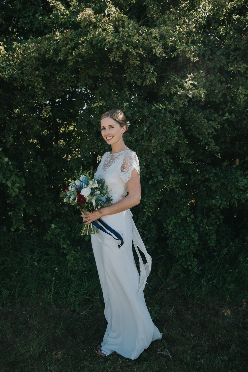 Bride Bridal Fitted Dress Silk Lace Overlay Blue Red Stocks Flowers Bouquet Strawberry Barn Wedding Jen Owens Images