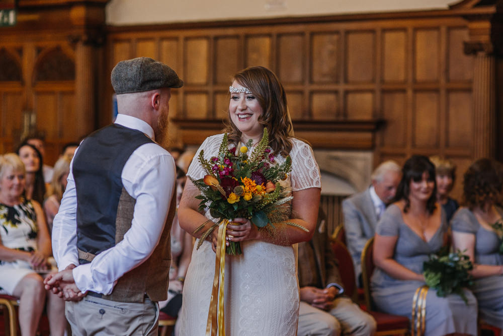 Bride Bridal High Neck Short Sleeve Lace Dress Crystal Headband Headpiece Sweetheart Neckline Waistcoat Tweed Chinos Flat Cap Multicoloured Bouquet Ribbon The Chimney House Wedding Ellie Grace Photography
