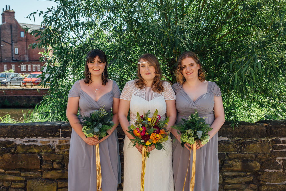 Bride Bridal High Neck Short Sleeve Lace Dress Crystal Headband Headpiece Sweetheart Neckline Waistcoat Slate Grey Bridesmaids Multicoloured Bouquet Ribbon The Chimney House Wedding Ellie Grace Photography