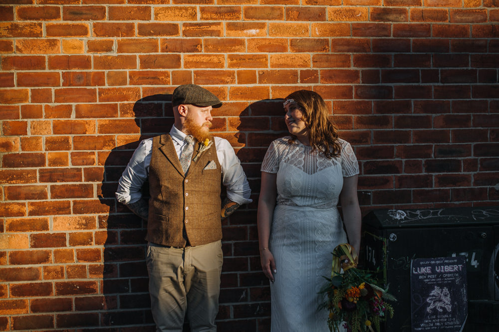 Bride Bridal High Neck Short Sleeve Lace Dress Crystal Headband Headpiece Sweetheart Neckline Waistcoat Tweed Chinos Flat Cap Multicoloured Bouquet Ribbon The Chimney House Wedding Ellie Grace Photography