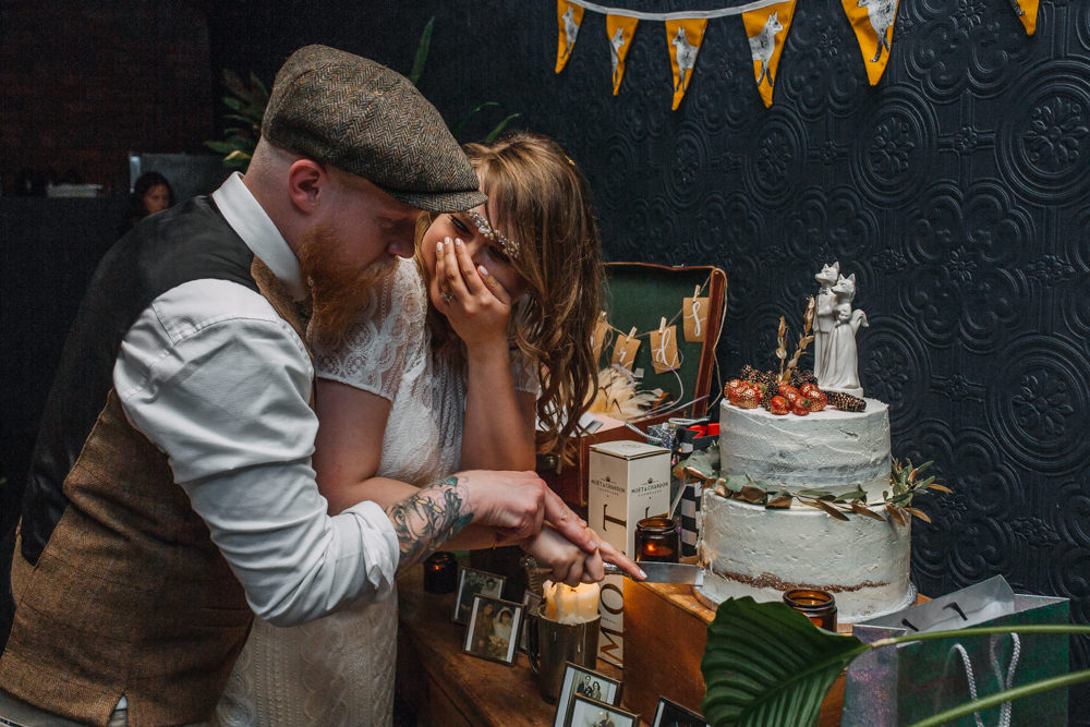 Bride Bridal High Neck Short Sleeve Lace Dress Crystal Headband Headpiece Sweetheart Neckline Waistcoat Tweed Chinos Flat Cap Cake Buttercream Fantastic Mr Fox Topper Cutting The Chimney House Wedding Ellie Grace Photography