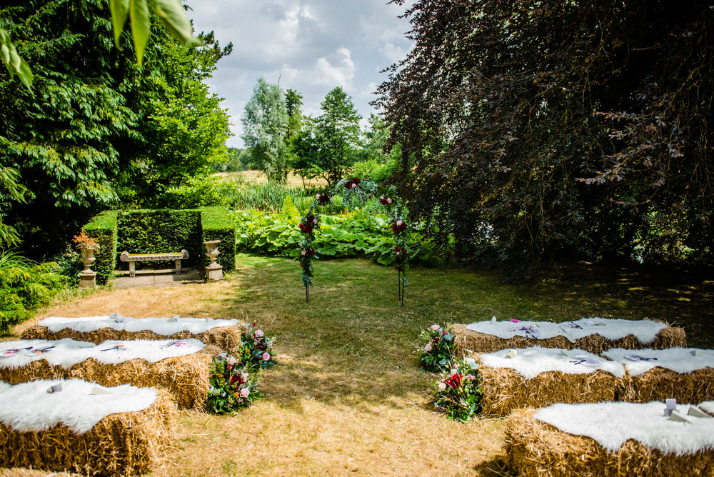 Hay Bales Seating Outdoor Ceremony Flower Aisle Arch Backdrop West Lexham Wedding James Powell Photography