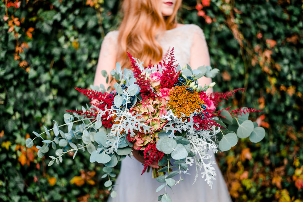 Bouquet Flowers Bride Bridal Red ORange Greenery Foliage Autumn Berries Hydrangea Eucalyptus Astilbe Autumnal Fairytale Wedding Ideas Miriam Peuser Photography