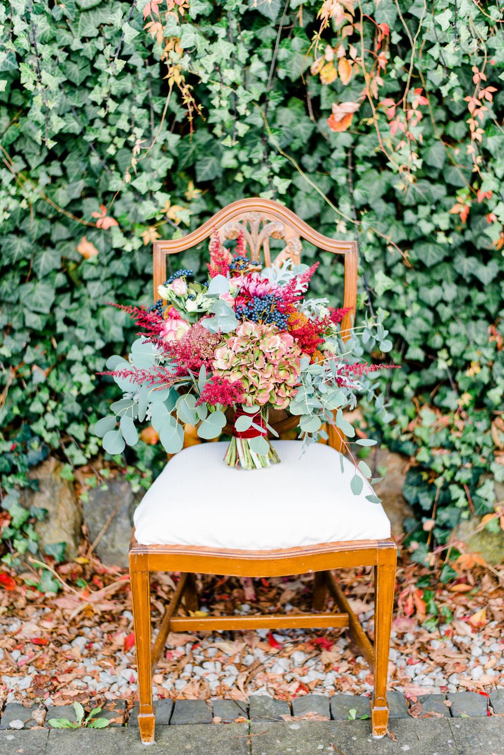 Bouquet Flowers Bride Bridal Red ORange Greenery Foliage Autumn Berries Hydrangea Eucalyptus Astilbe Autumnal Fairytale Wedding Ideas Miriam Peuser Photography