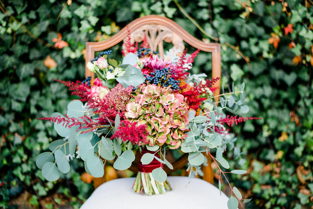 Bouquet Flowers Bride Bridal Red ORange Greenery Foliage Autumn Berries Hydrangea Eucalyptus Astilbe Autumnal Fairytale Wedding Ideas Miriam Peuser Photography
