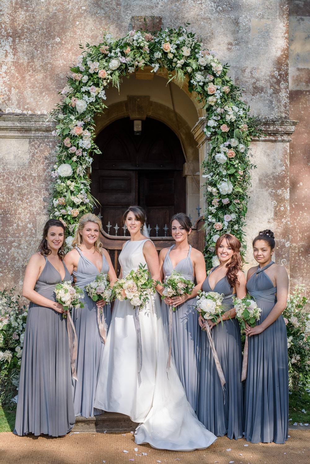 Bride Bridal A Line Dress Straps Sleeveless Silk Boat Neck Veil Entrance Archway Floral Flowers Bouquet Silk Ribbon Bridesmaids Multiway Grey Platinum Babington House Wedding Ria Mishaal Photography