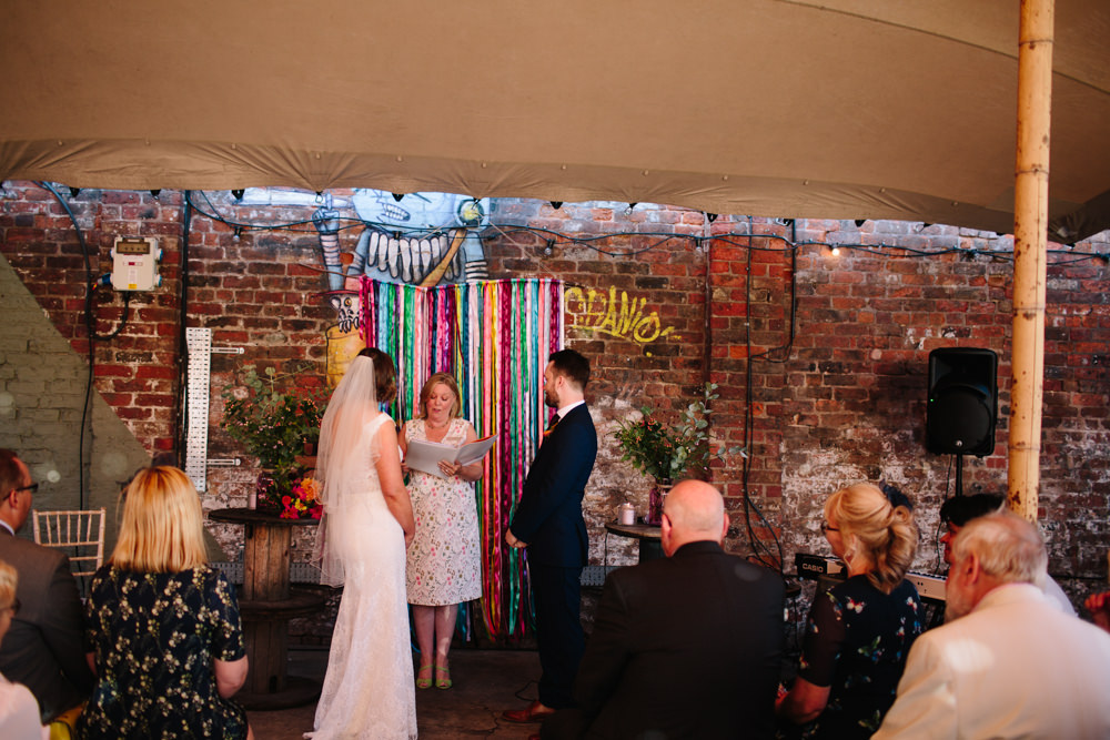 Bride Bridal Watters Lace Sleeveless Dress Gown Navy Suit Groom Colourful Veil Ribbon Backdrop Constellations Liverpool Wedding Dan Hough Photo