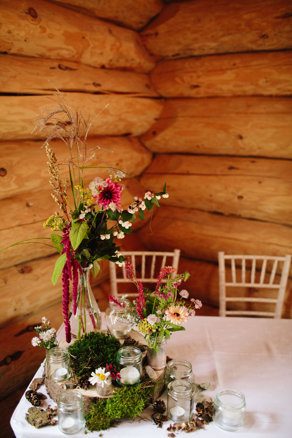 Table Flowers Decor Fern Dahlia Red Trailing Amaranthus Centrepiece Decor Moss Log Hidden River Cabins Wedding Dan Hough Photo