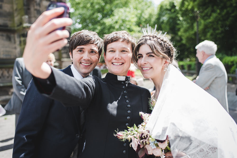 Bride Bridal Rue de Seine Dress Gown 70s Boho Sleeves Headdress Crown Morning Suit Groom Vicar Selfie Langar Hall Wedding Robert Leons Photography