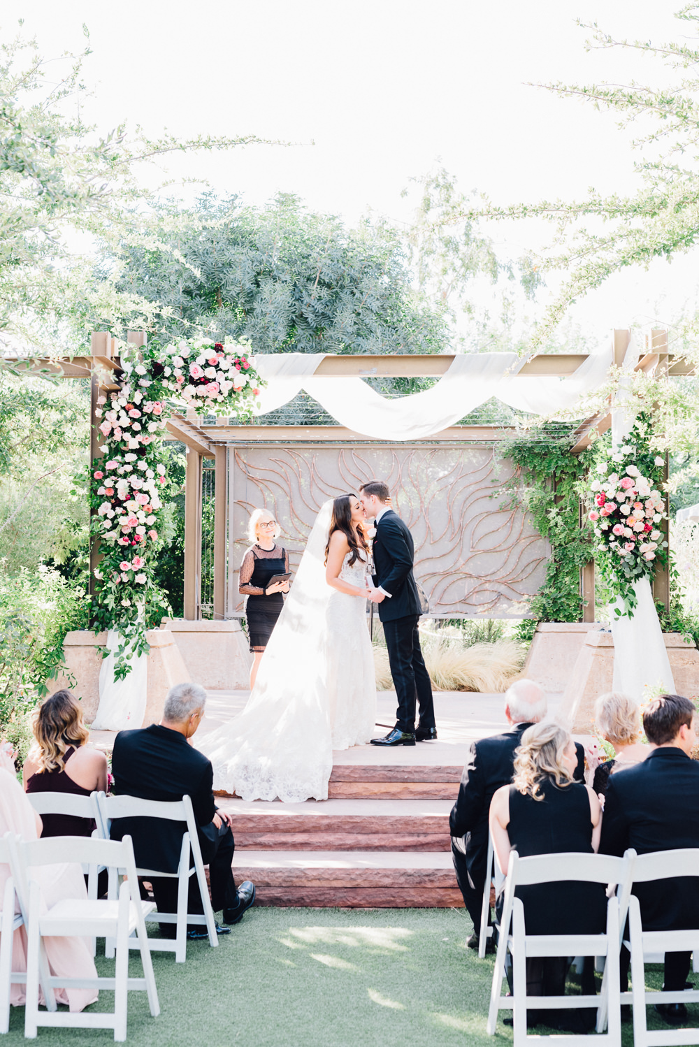 Outdoor Ceremony Wooden Backdrop Arch Drapes Fabric Pink Flowers Romantic Soft Elopement Wedding Las Vegas Kristen Joy Photography