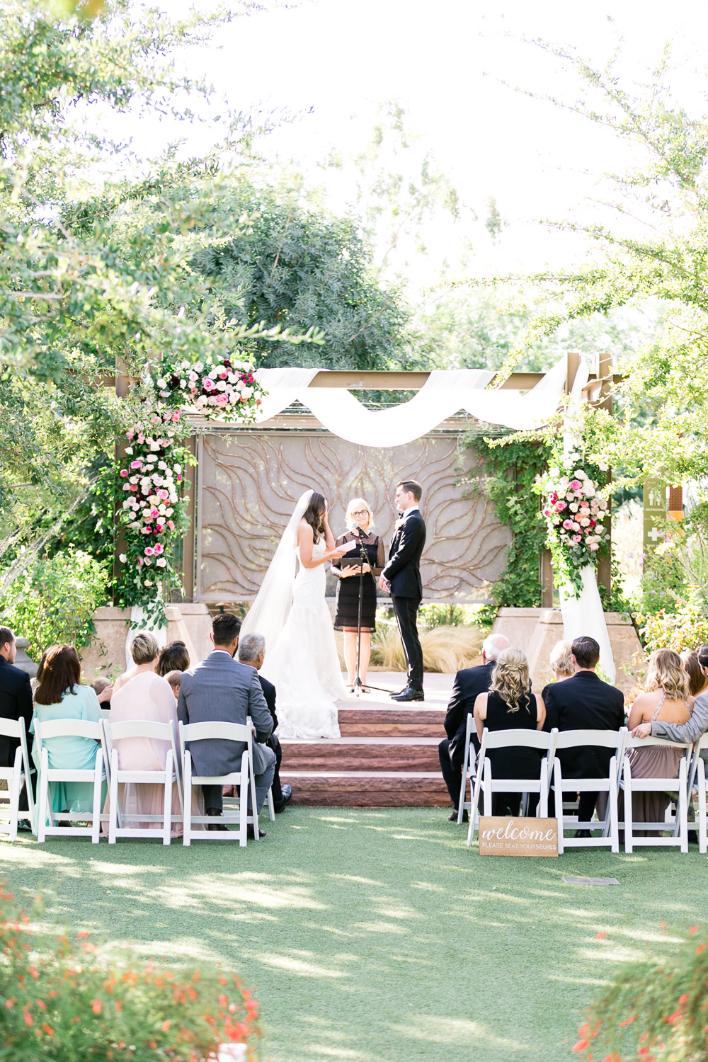 Outdoor Ceremony Wooden Backdrop Arch Drapes Fabric Pink Flowers Romantic Soft Elopement Wedding Las Vegas Kristen Joy Photography