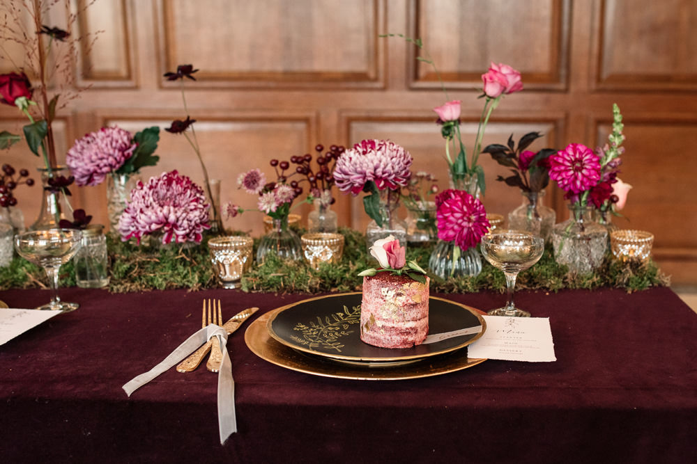 Table Tablescape Decor Red Velvet Cloth Flowers Pink Bottles Moss Gold Candles Plates Winter Luxe Wedding Ideas Becky Harley Photography
