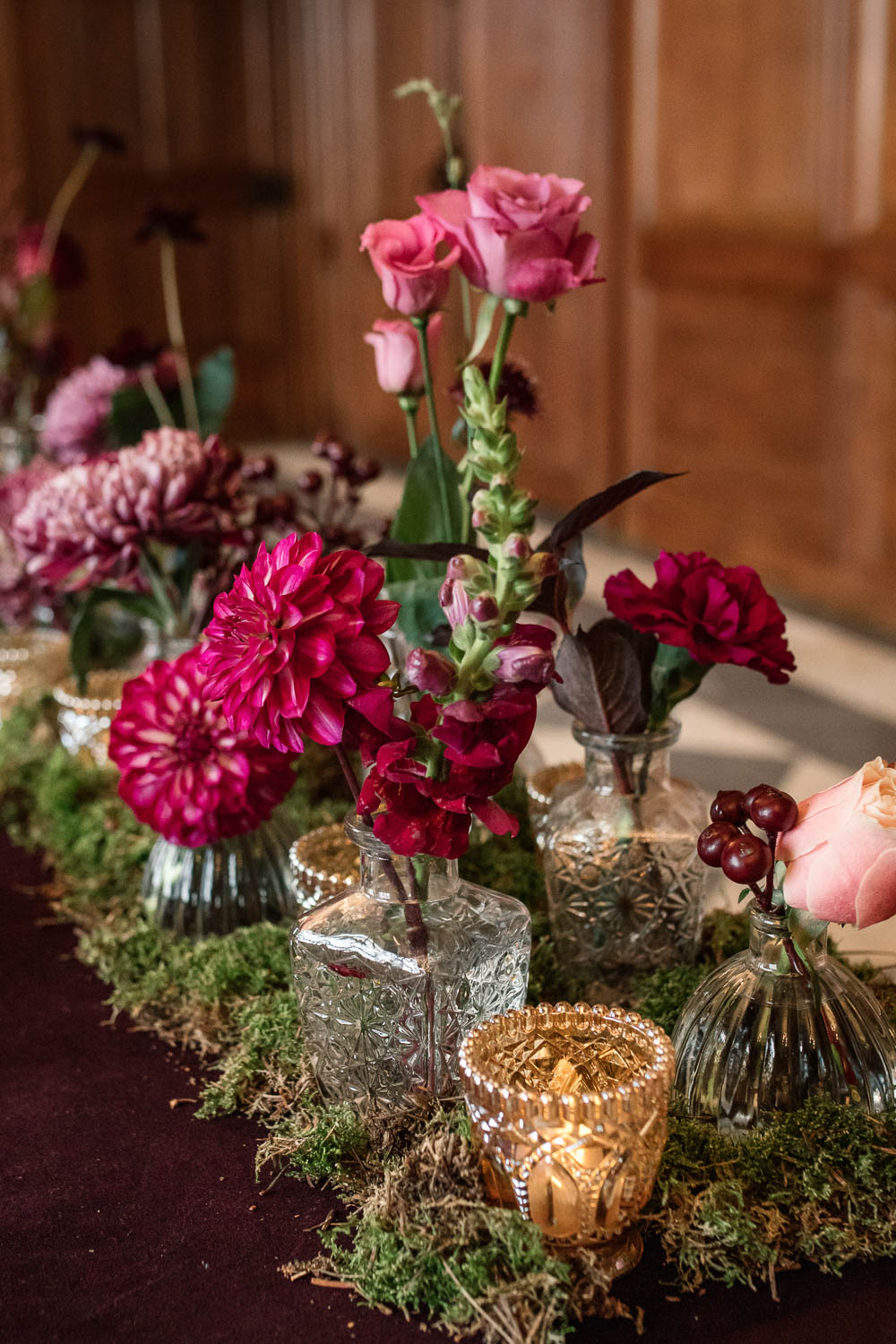 Bottle Flowers Table Centrepiece Decor Red Pink Moss Gold Dahlia Rose Winter Luxe Wedding Ideas Becky Harley Photography