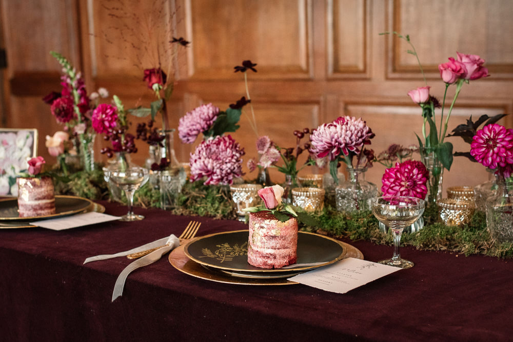 Table Tablescape Decor Red Velvet Cloth Flowers Pink Bottles Moss Gold Candles Plates Winter Luxe Wedding Ideas Becky Harley Photography
