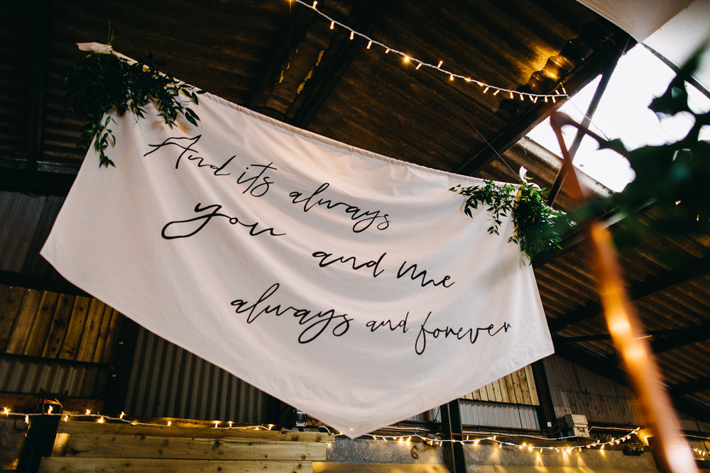 Ceremony Aisle Backdrop Barn Bohemian Macrame Banner Fabric Sign Fairy Lights Greenery Quote Bawdon Lodge Farm Wedding Hannah Hall Photography