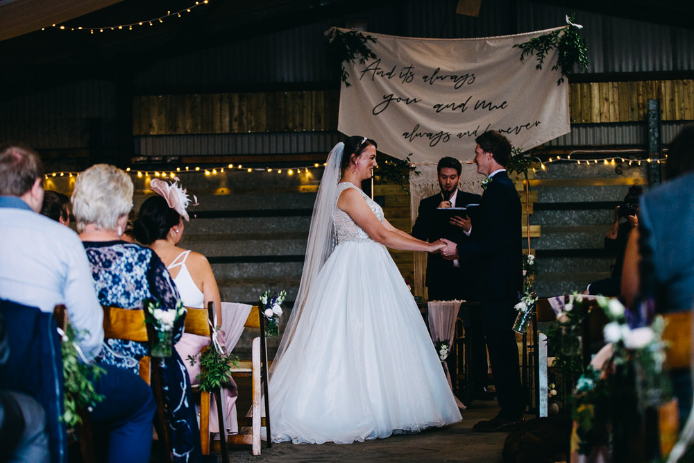 Ceremony Aisle Backdrop Barn Bohemian Macrame Banner Fabric Sign Fairy Lights Greenery Quote Bawdon Lodge Farm Wedding Hannah Hall Photography