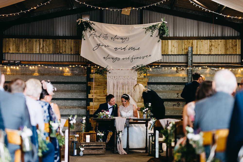 Ceremony Aisle Backdrop Barn Bohemian Macrame Banner Fabric Sign Fairy Lights Greenery Quote Bawdon Lodge Farm Wedding Hannah Hall Photography