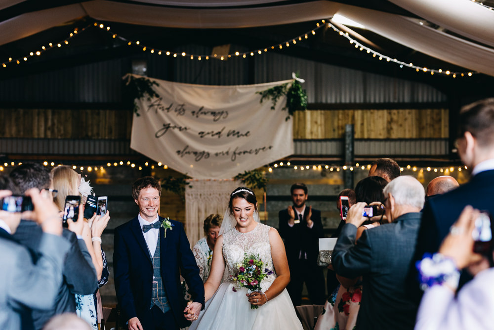 Ceremony Aisle Backdrop Barn Bohemian Macrame Banner Fabric Sign Fairy Lights Greenery Quote Bawdon Lodge Farm Wedding Hannah Hall Photography