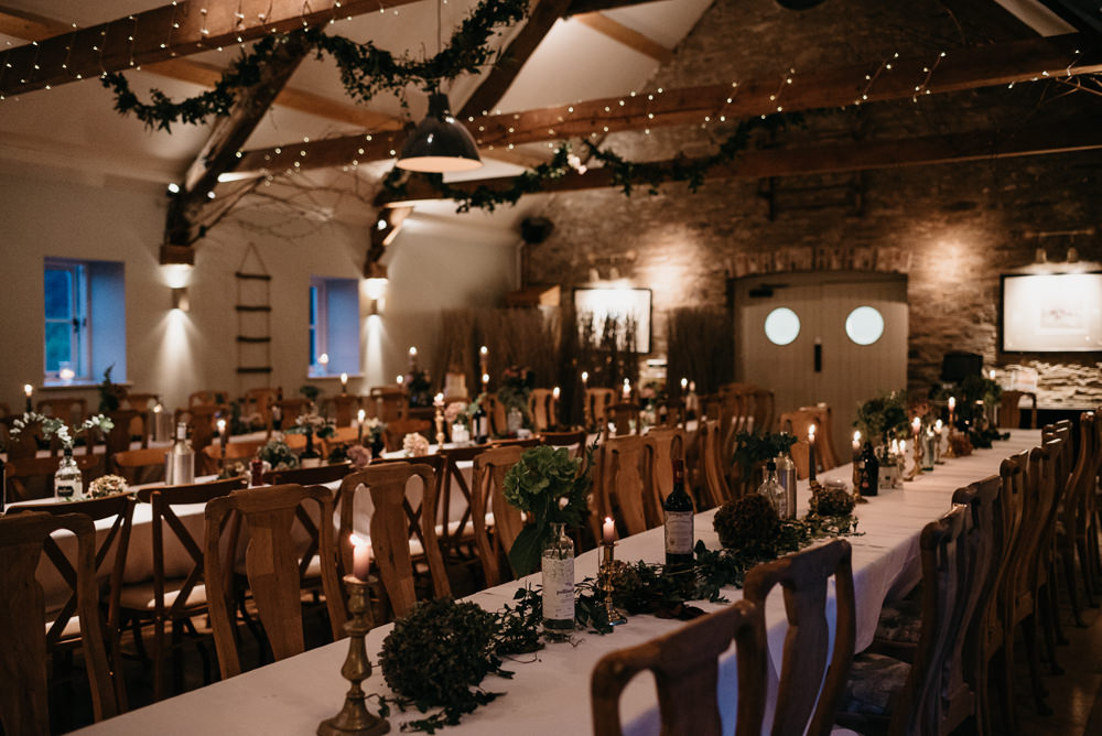 Fairy Lights Barn Greenery Beams Foliage Decor Candles Long Tables Bodnant Welsh Food Wedding Elaine Williams Photography