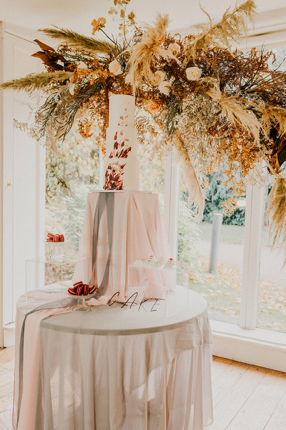 Cake Table Grasses Flowers Backdrop Installation Suspended Pampass Grass Sign Bohemian Music Folk Wedding Ideas Gail Secker Photography