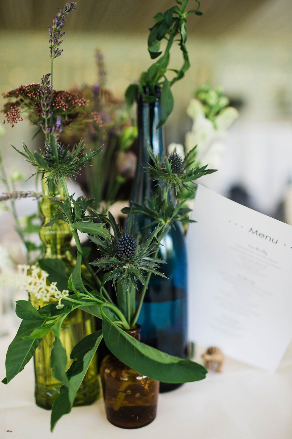 Bottles Flowers Wild Table Decor Centrepiece Cherwell Boathouse Wedding Claudia Rose Carter Photography