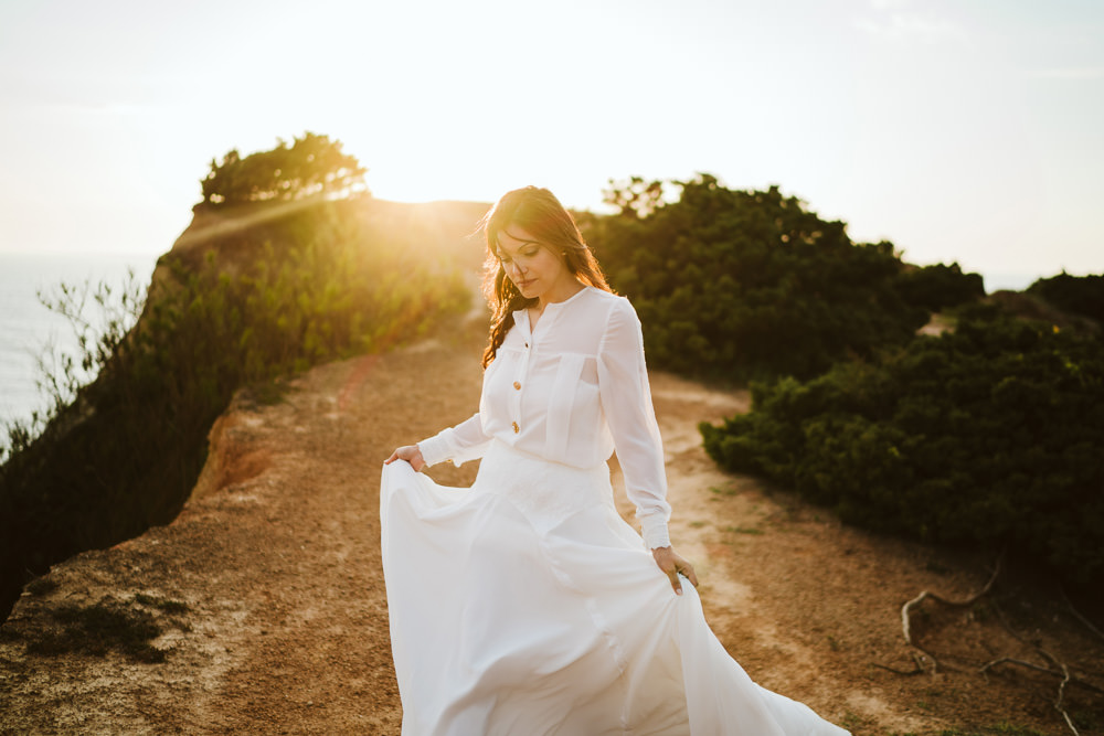 Dress Gown Bride Bridal Buttons Skirt Long Sleeves Clifftop Portugal Wedding Ideas John Barwood Photography