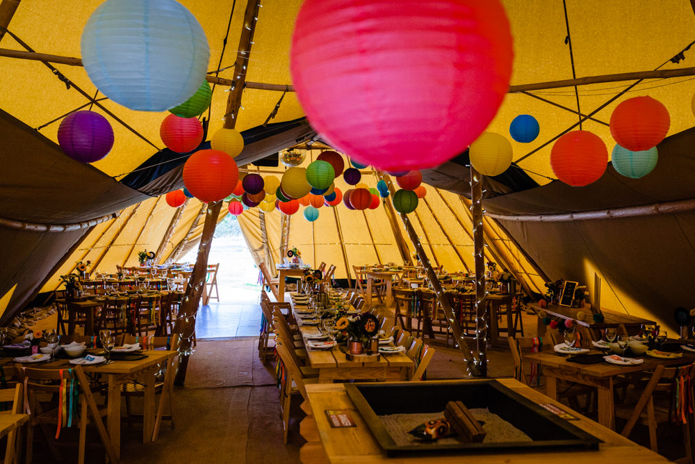 Tipi Lanterns Decor Rustic Tables Rainbow Decor Colourful Festival Party Wedding Emma and Rich Photography