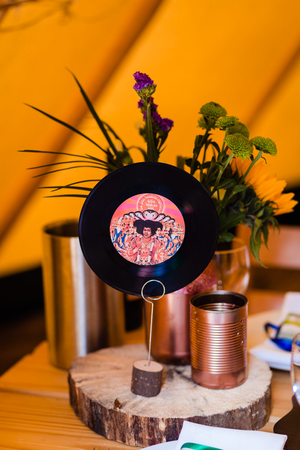 Centrepiece Decor Log Table Tine Jar Flowers Vinyl Table Name Number Record Music Colourful Festival Party Wedding Emma and Rich Photography