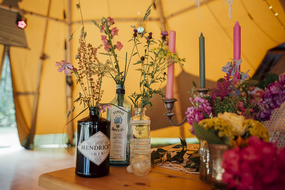 Table Flowers Bottles Decor Centrepiece Wild Meadow Colourful Pretty Floral Tipi Boho Wedding Ideas Purple Pear Tree Photography