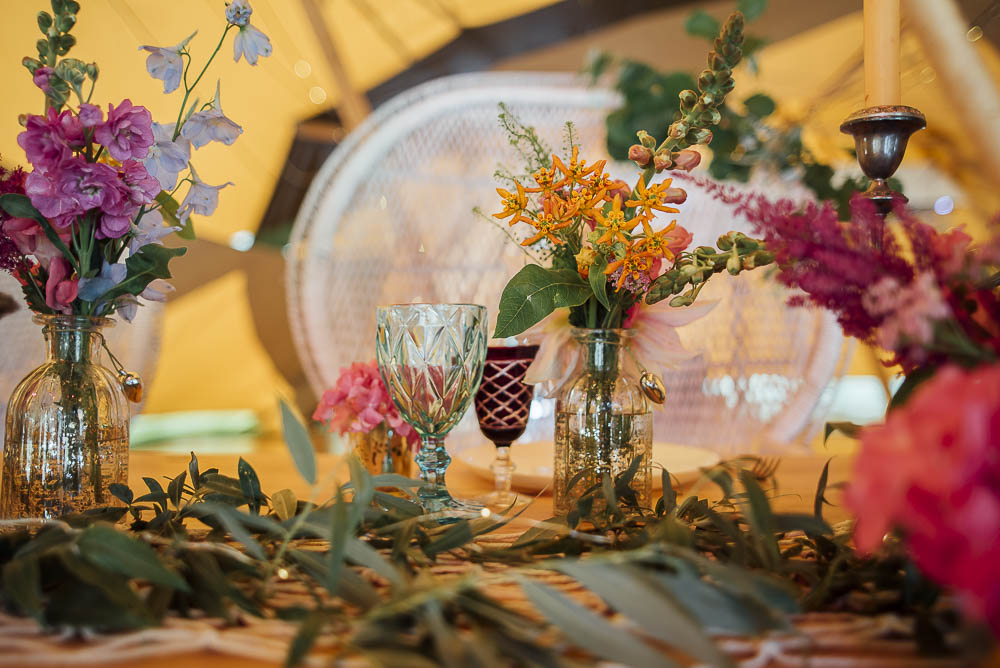 Table Flowers Bottles Decor Centrepiece Wild Meadow Colourful Pretty Floral Tipi Boho Wedding Ideas Purple Pear Tree Photography