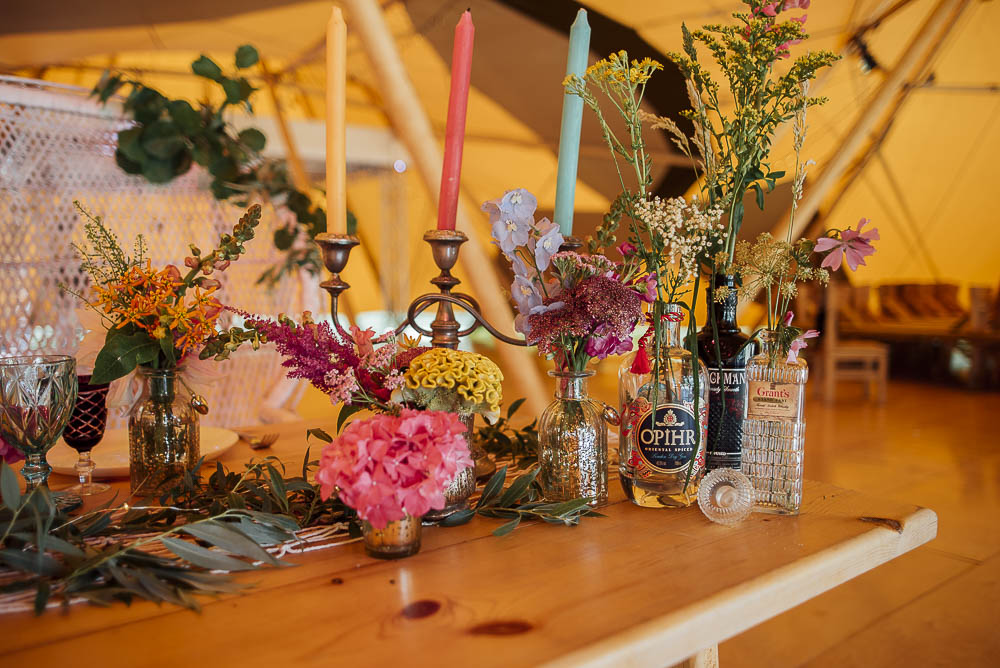 Table Flowers Bottles Decor Centrepiece Wild Meadow Candles Colourful Pretty Floral Tipi Boho Wedding Ideas Purple Pear Tree Photography