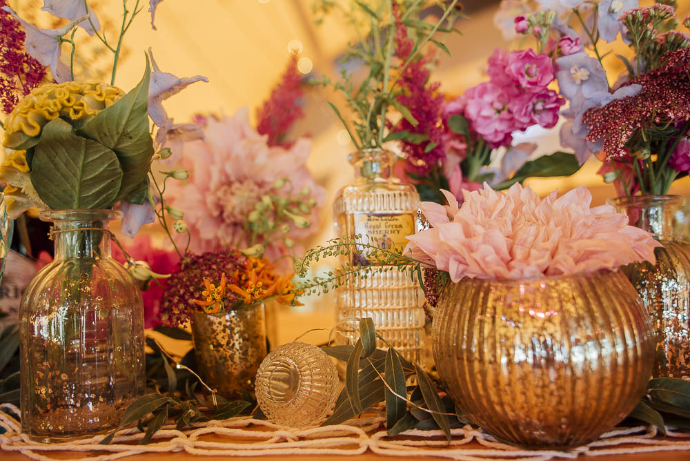 Colourful Pretty Floral Tipi Boho Wedding Ideas Purple Pear Tree PhotographyTable Flowers Bottles Decor Centrepiece Wild Meadow
