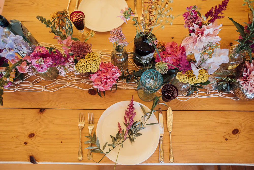 Table Flowers Bottles Decor Centrepiece Wild Meadow Colourful Pretty Floral Tipi Boho Wedding Ideas Purple Pear Tree Photography