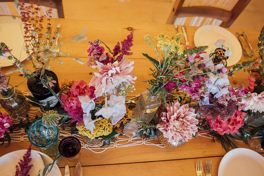 Table Flowers Bottles Decor Centrepiece Wild Meadow Colourful Pretty Floral Tipi Boho Wedding Ideas Purple Pear Tree Photography