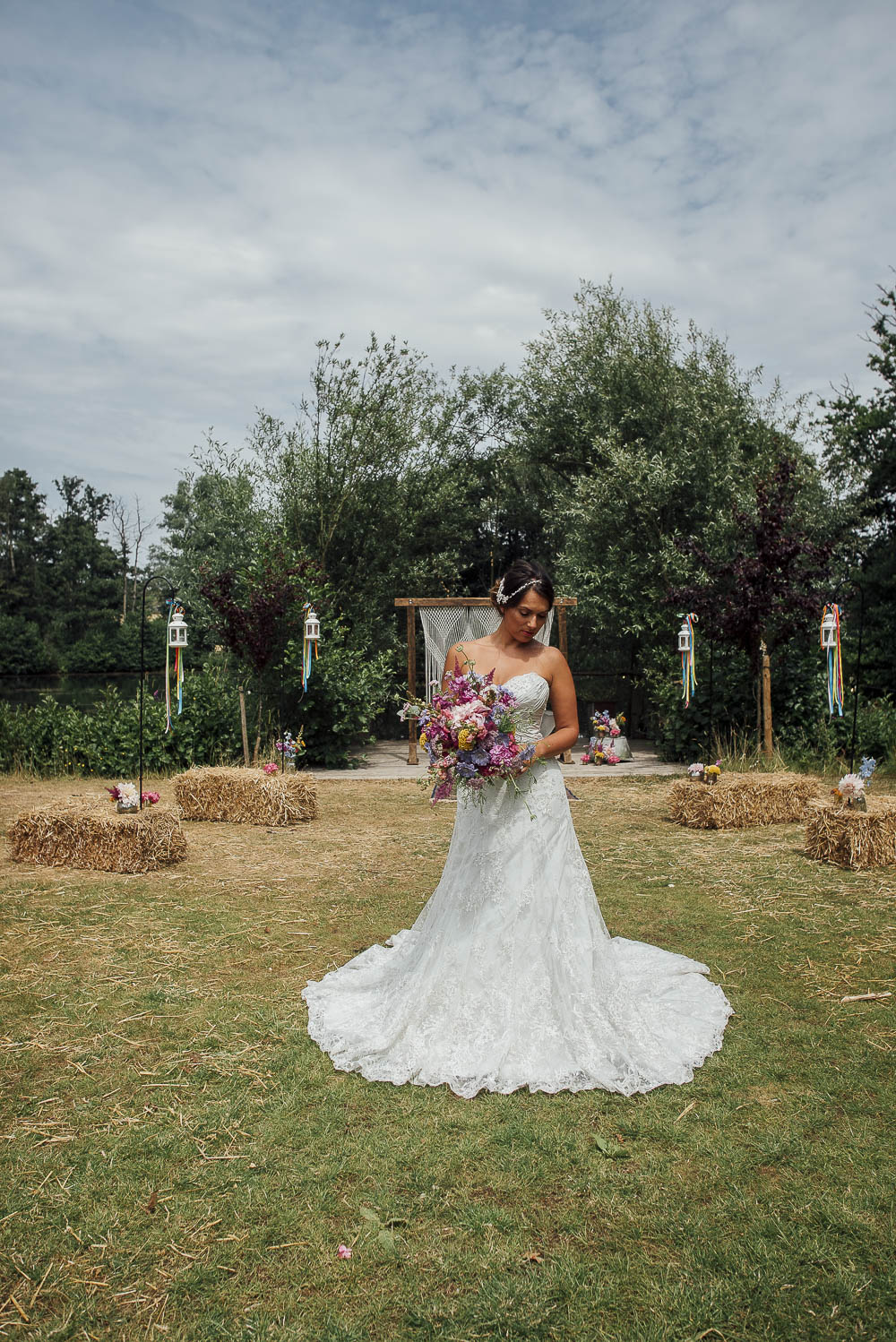Macrame Wooden Frame Backdrop Ceremony Aisle Persian Rug Ribbons Flowers Colourful Pretty Floral Tipi Boho Wedding Ideas Purple Pear Tree Photography