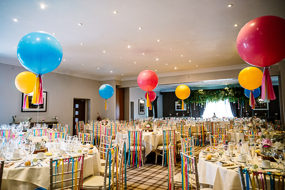 Reception Room Decor Giant Balloons Colourful Tassel Ribbons Coniston Hotel Wedding Hayley Baxter Photography