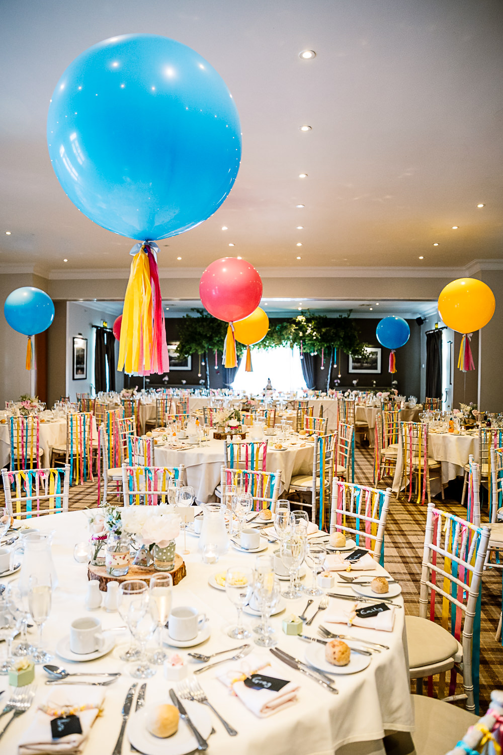 Reception Room Decor Giant Balloons Colourful Tassel Ribbons Coniston Hotel Wedding Hayley Baxter Photography