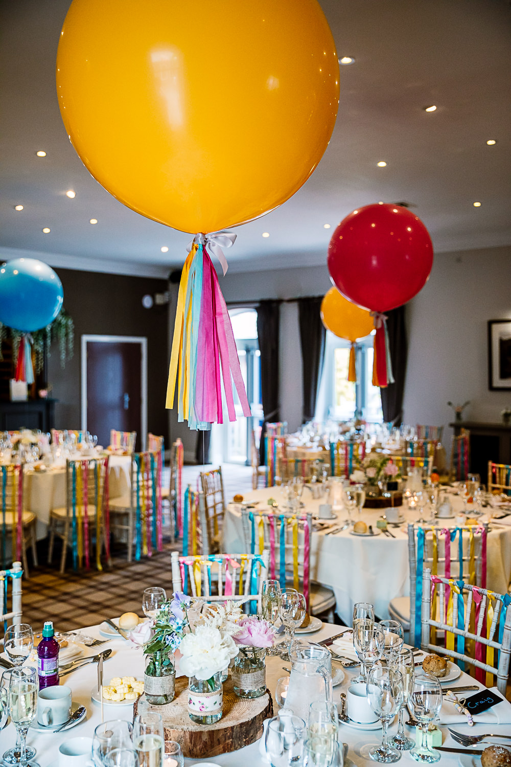 Reception Room Decor Giant Balloons Colourful Tassel Ribbons Coniston Hotel Wedding Hayley Baxter Photography