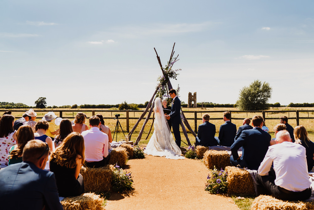 Wooden Triangle Ceremony Aisle Backdrop Flowers Arch Outdoor Hay Bales Godwick Hall Wedding Rob Dodsworth Photography