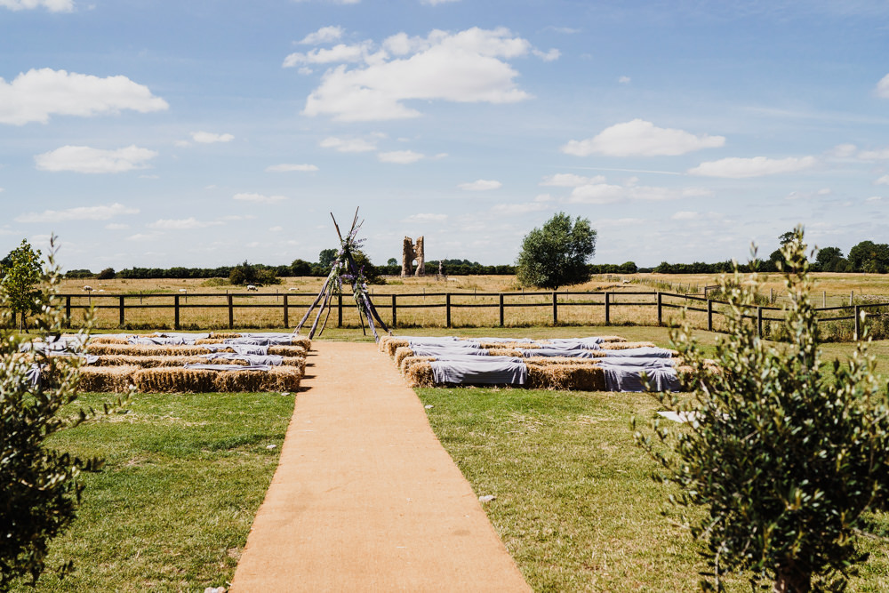 Wooden Triangle Ceremony Aisle Backdrop Flowers Arch Outdoor Hay Bales Godwick Hall Wedding Rob Dodsworth Photography