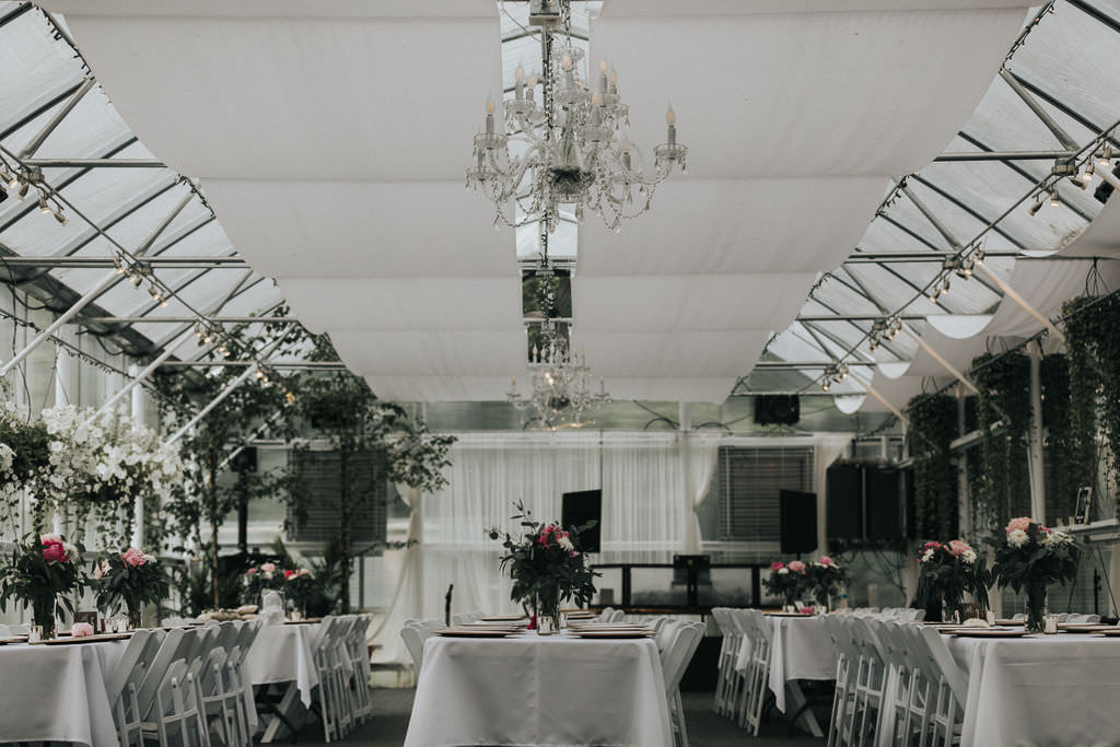 Glasshouse Drapes Decor Chic Modern Flowers Long Tables Greenhouse Garden Washington Wedding Beginning and End Photography