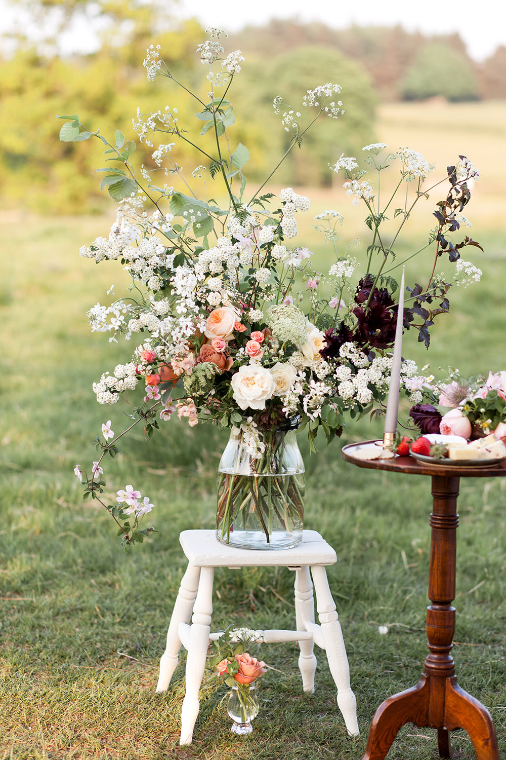 Table Flowers Peach Coral Cream Roses Greenery Foliage Large Vase Tall Light Airy Summer Wedding Ideas Charlotte Palazzo Photography